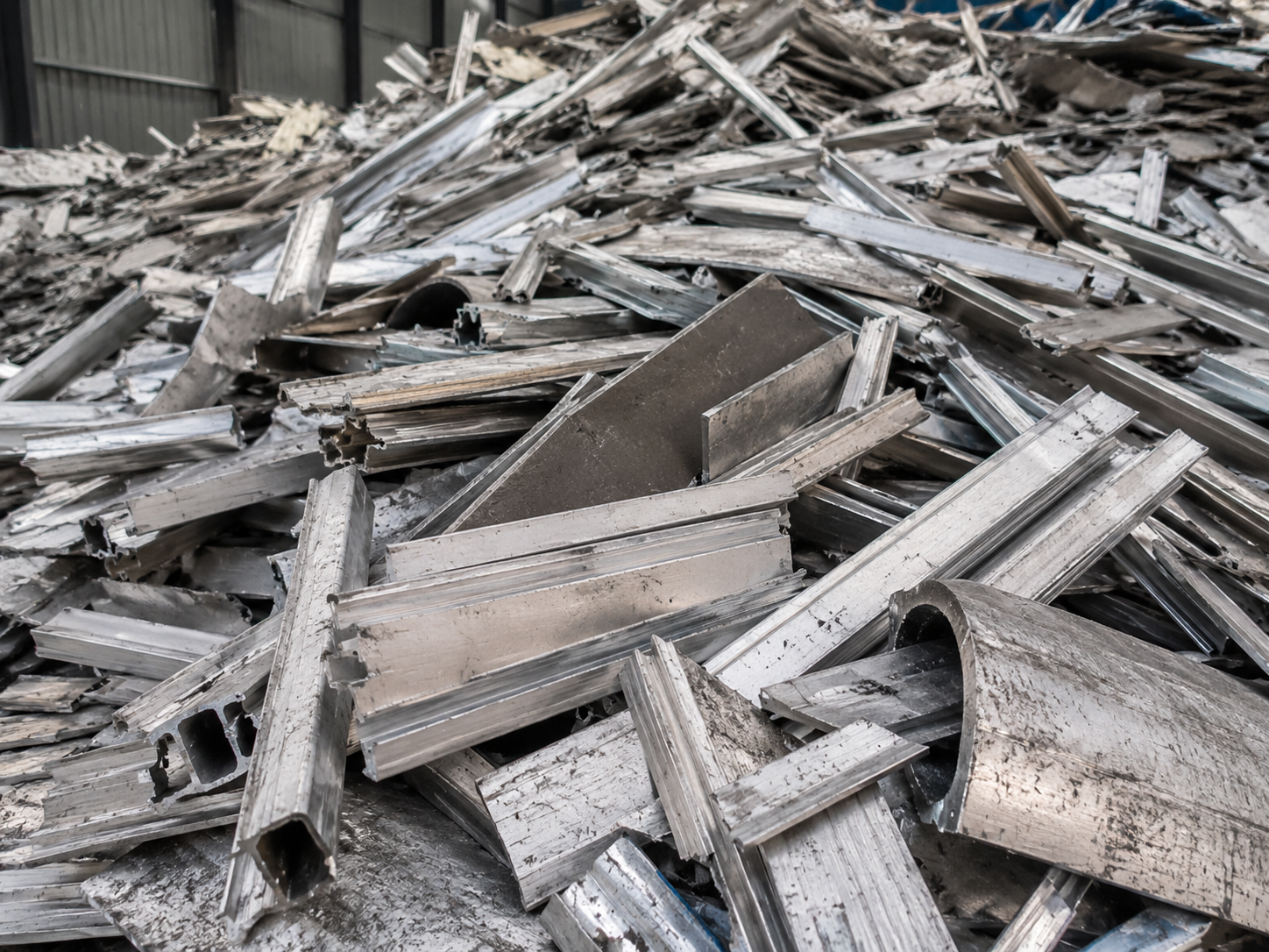 Scrap aluminum material stacked in an industrial recycling yard